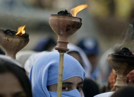 An activist takes part in a rally to mark International Women's Day in Islamabad March 8, 2007. Pakistani President Pervez Musharraf vowed on Thursday to support reforms to empower women in the male-dominated society, but said the ultimate responsibility for change lay with women.