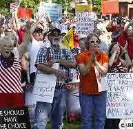 Anger beyond health care debate fuels emotional town meetings